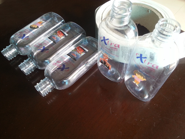 transparent labels labelled samples bottles plane surface Mrwan vzorec prozornih etiket in steklenic (3).jpg